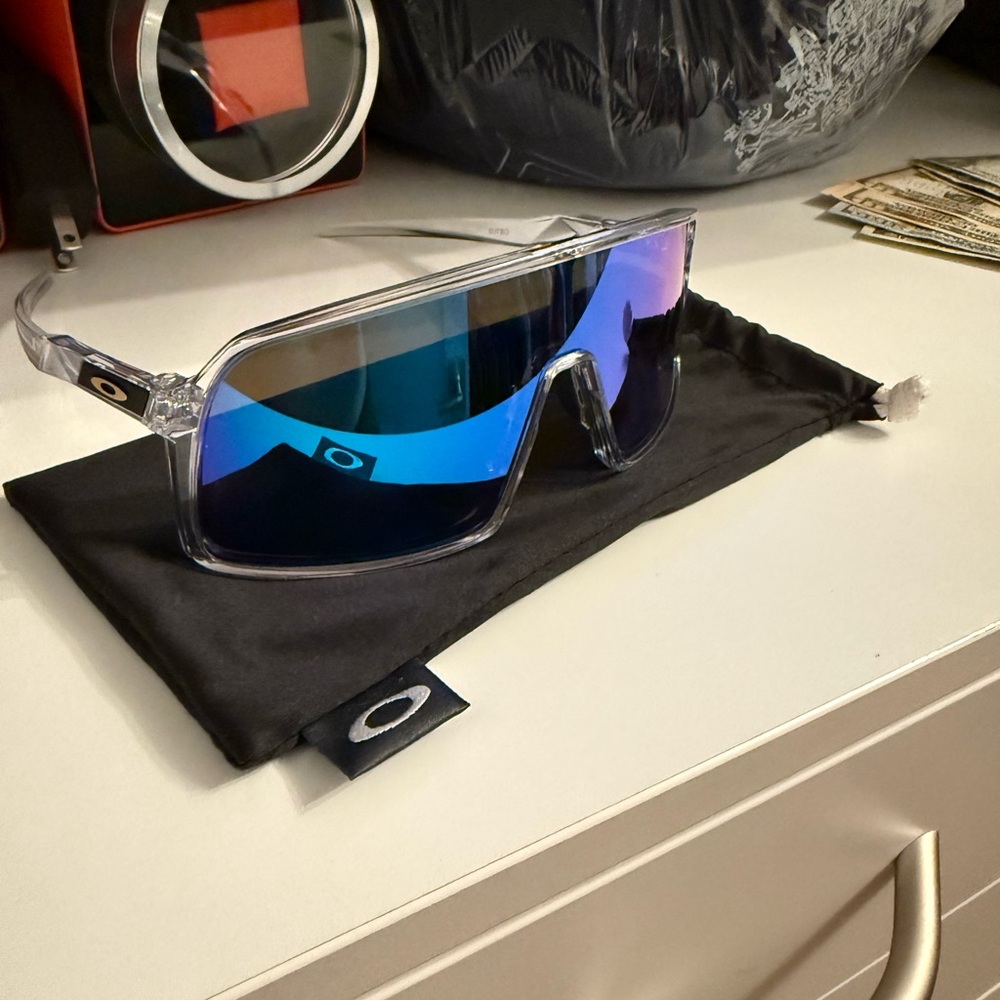 Oakley Sutro Transparent Frame Sunglasses with Reflective Blue Lenses